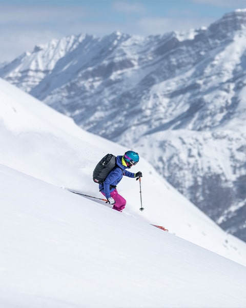 Girl skiing on the snow-covered mountain of Carosello 3000 in Livigno