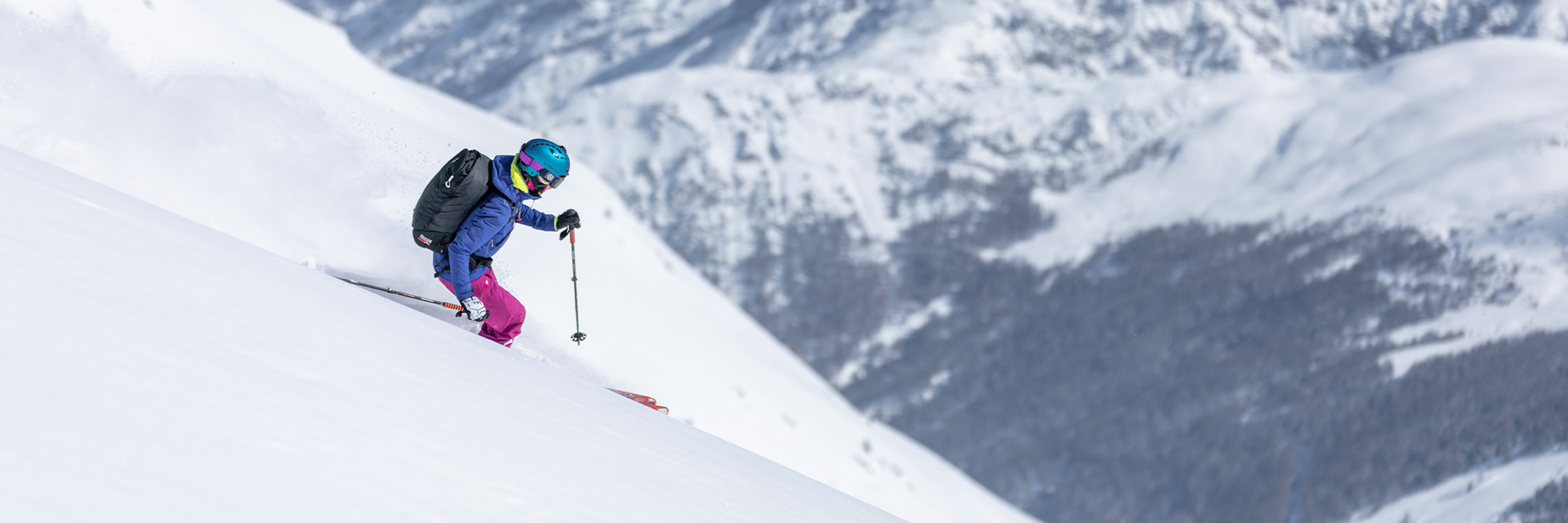 Girl skiing on the snow-covered mountain of Carosello 3000 in Livigno